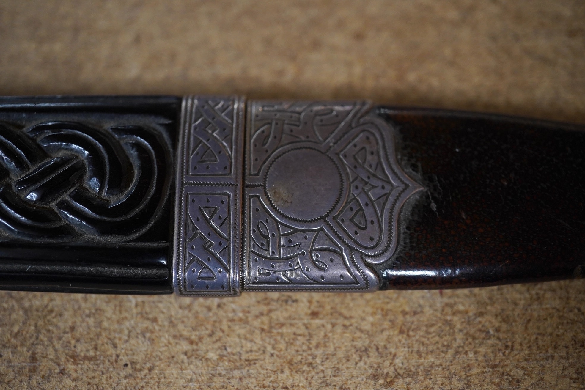 A George V Scottish silver mounted ebony and leather singh dhu, George Paul, Edinburgh, 1919, 16.6cm. Condition - poor